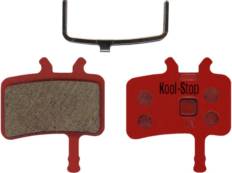 Red brake pads with Kool-Stop branding on a white background
