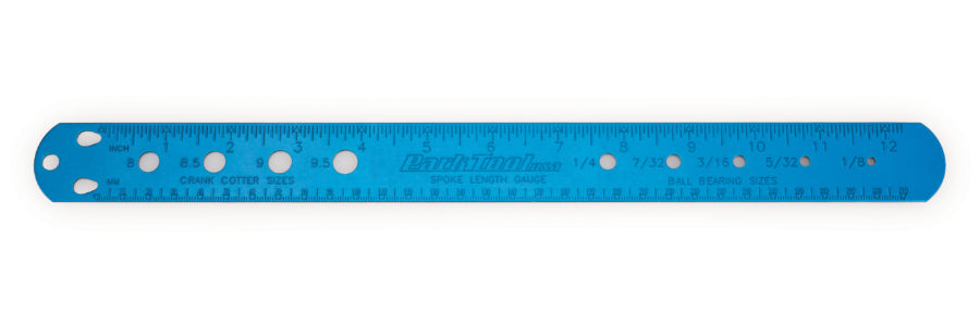 Blue ruler with measurement markings on a white background