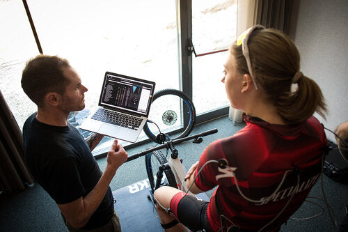 Riding and fitter discussing findings from the fitting process