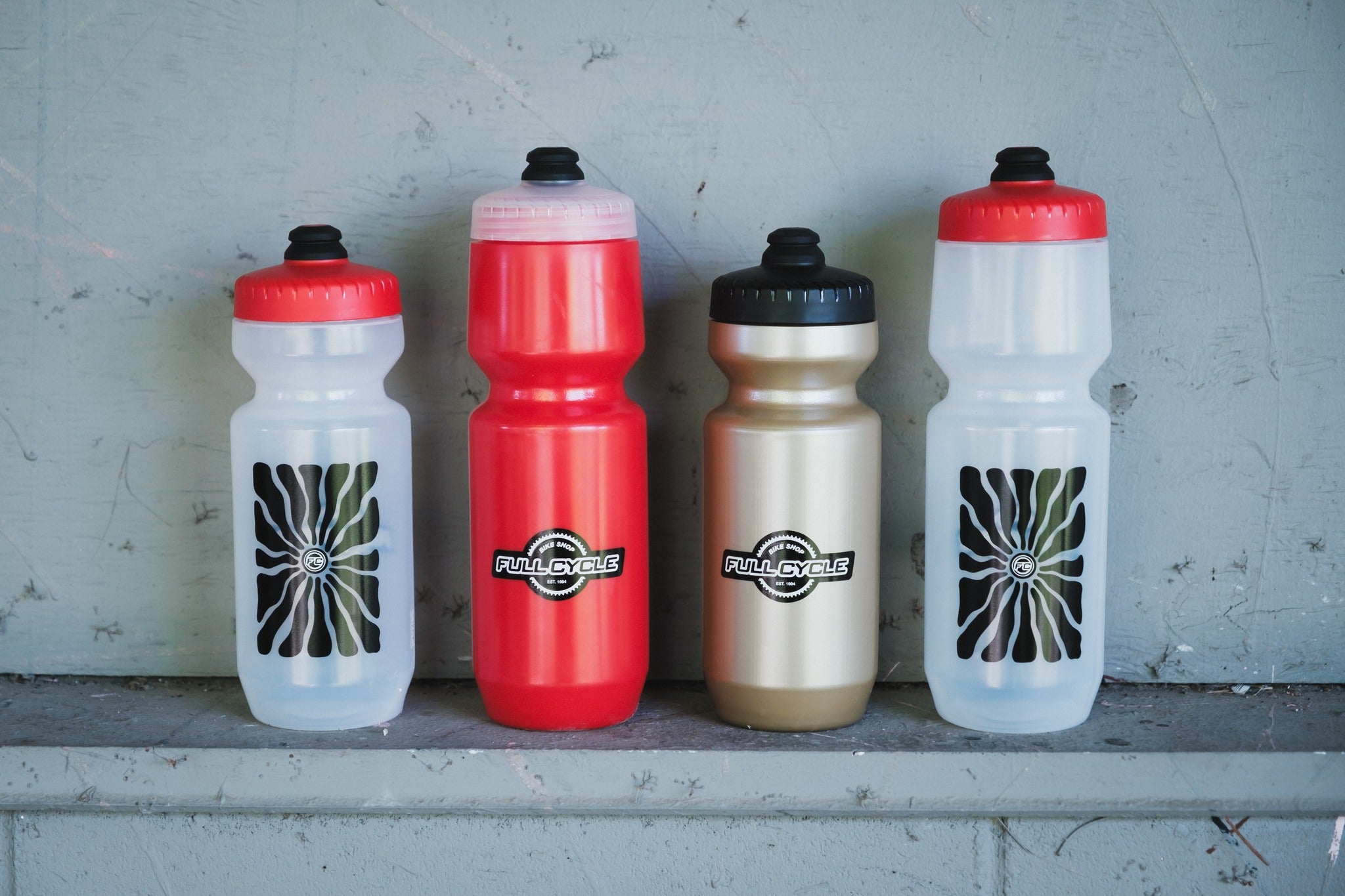 Assorted cycling water bottles with full cycle branding 